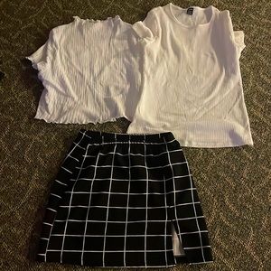 2 White Shirts and One plaid black and white Skirt.